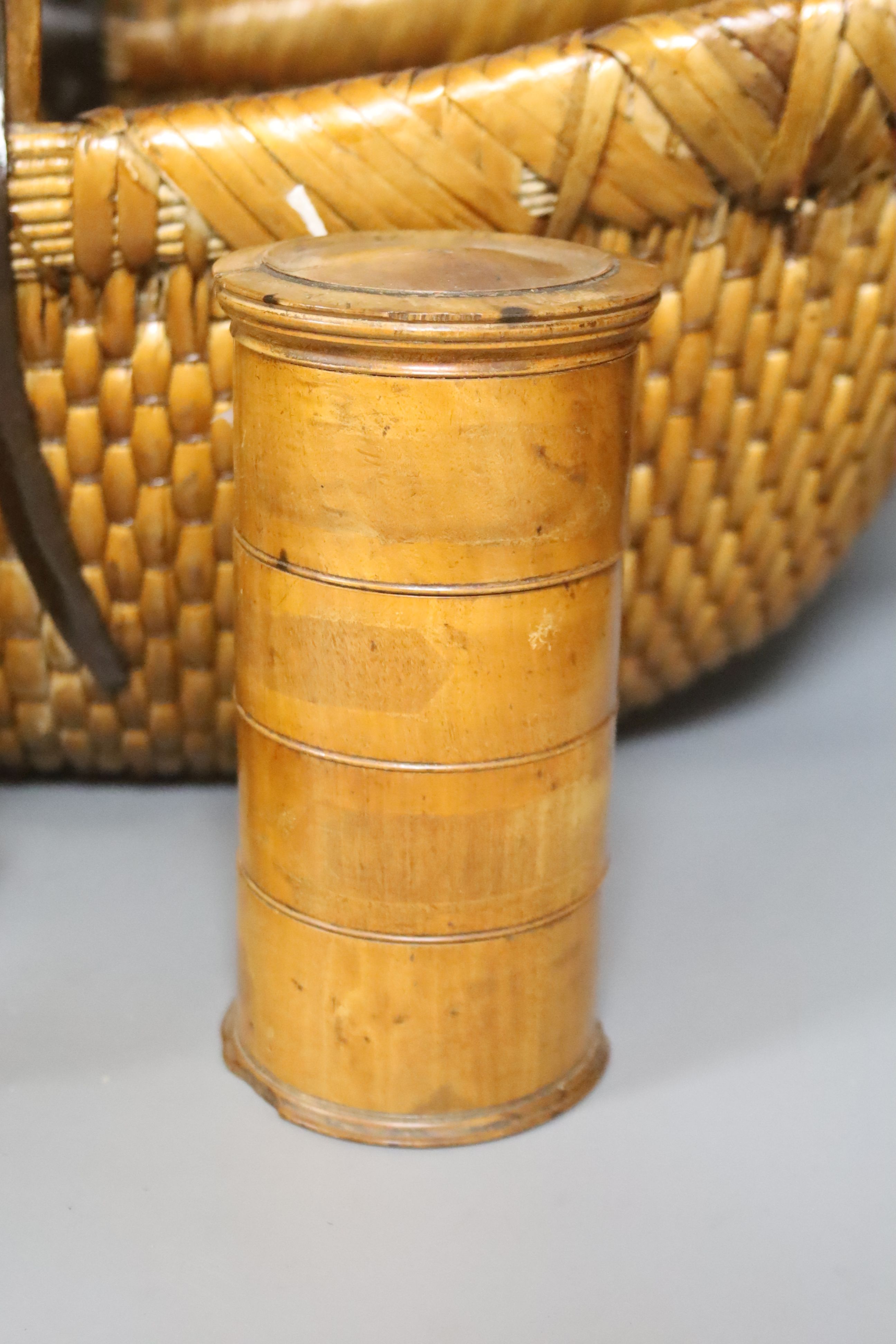 A Victorian boxwood spice tower, 17cm, a 19th century French walnut coffee grinder, 22cm and a vintage Japanese metal-bound woven bamboo basket, width 59cm